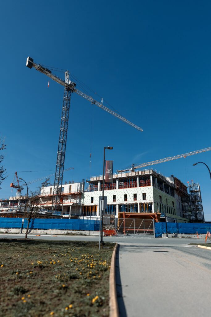 Two cranes hover over the new Surrey Hospital, that is currently under construction